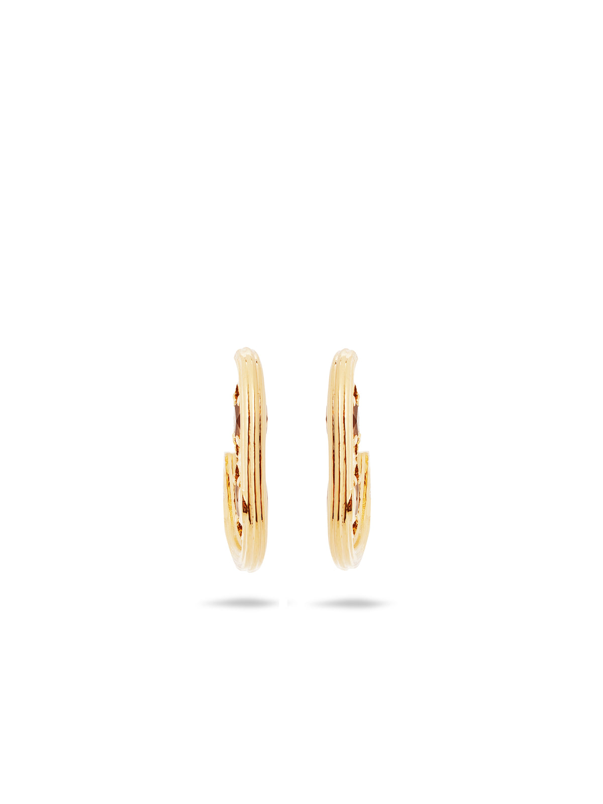 Gold hoop earrings and faceted glass